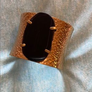 Gold cuff with black agate stone